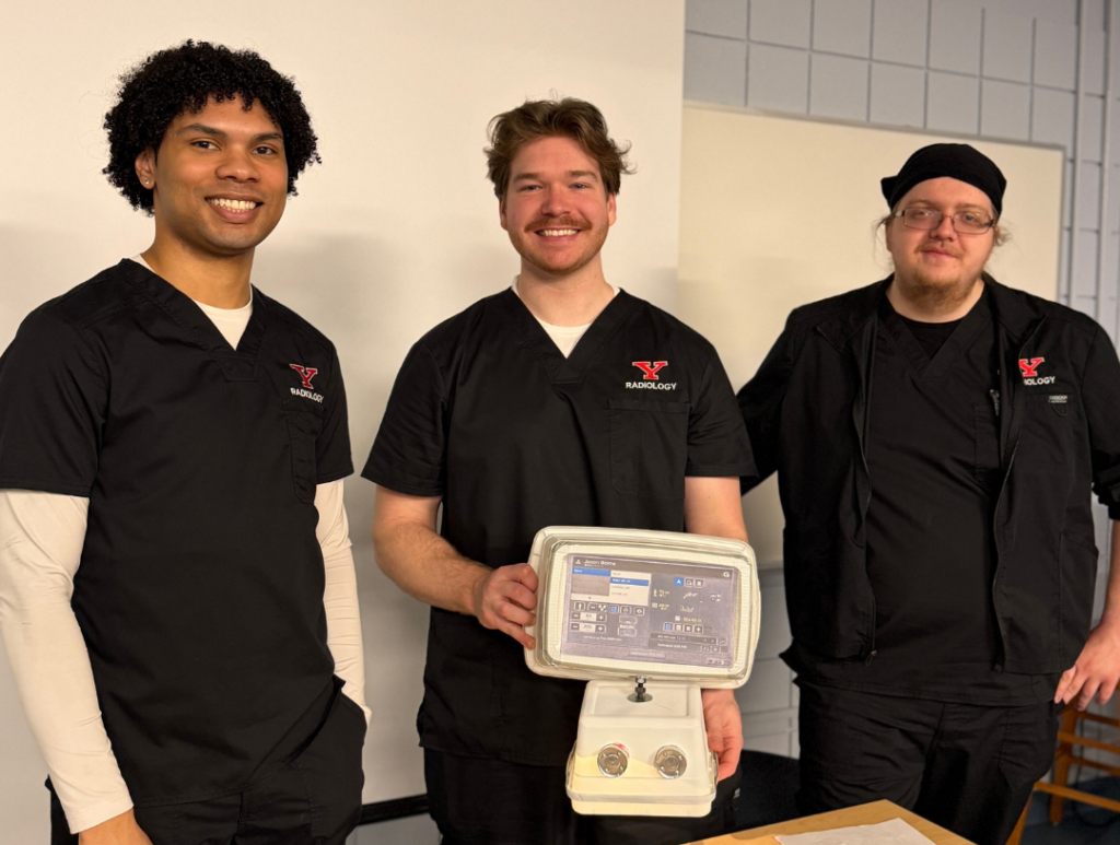 YSU Radiologic Technology students practicing with imaging equipment during hands-on lab training.