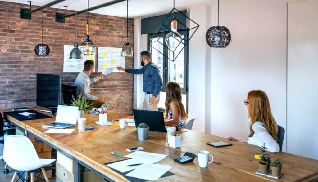 Team leader organizing work in an office