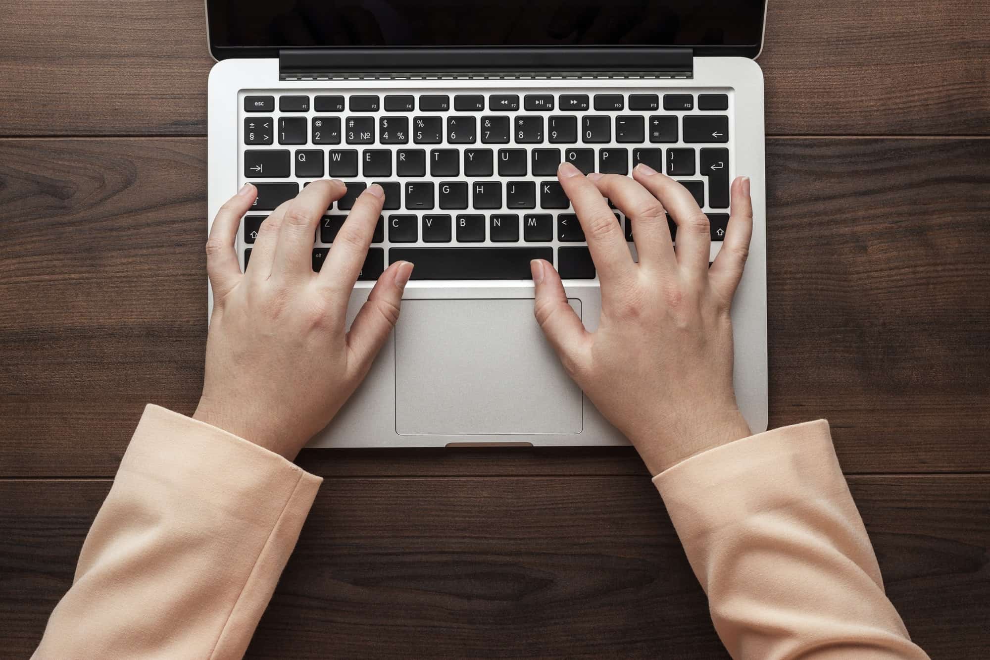 businesswoman typing on the laptop