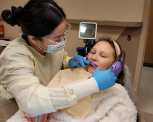 YSU Dental Hygiene Student with a patient.