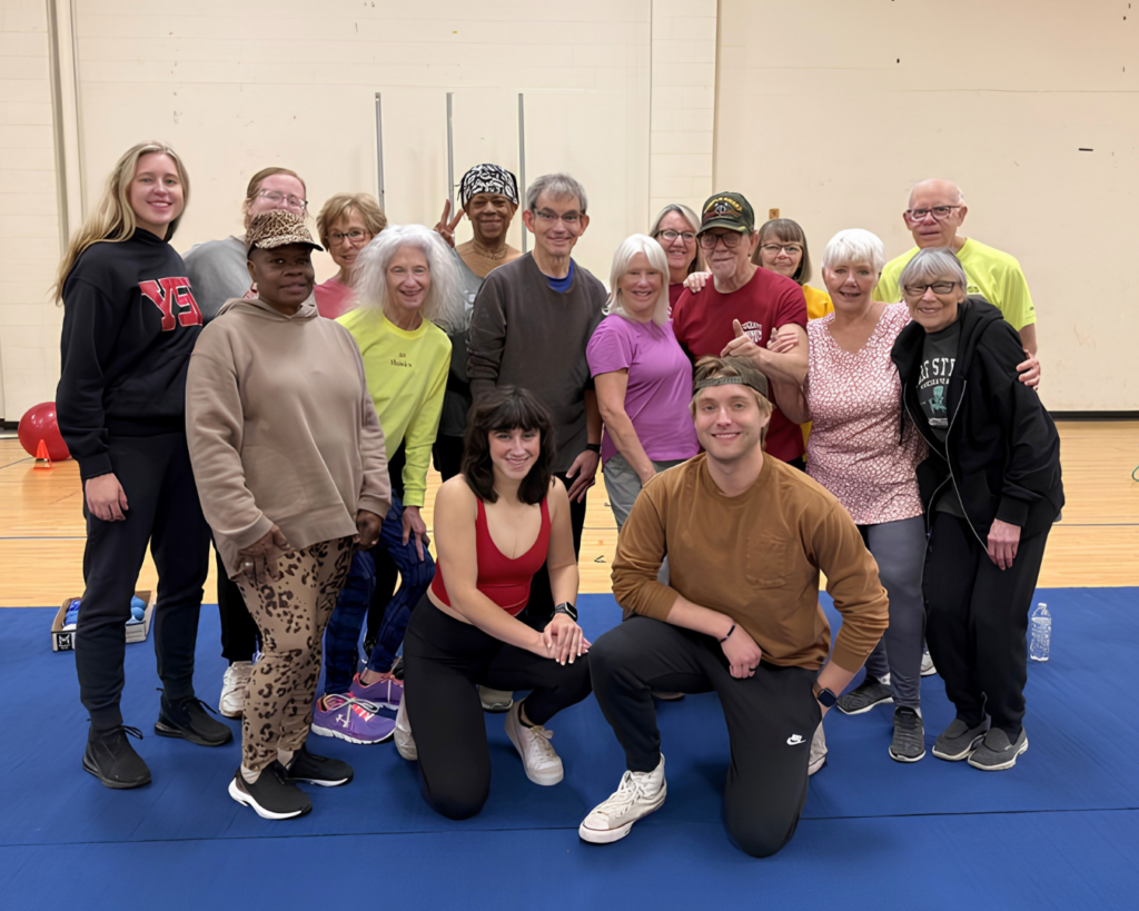 Neva, Madison, and Theresa posing with their Active Aging & Rehabilitation Lab Participants.
