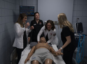 Respiratory Care students participating in a ventilation simulation using a high-fidelity adult mannequin in YSU's Respiratory Care Simulation Lab.