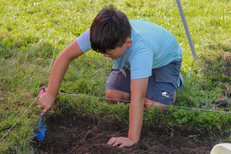 Trumbull Country Historical Society camper digging at the YSU archeology site.