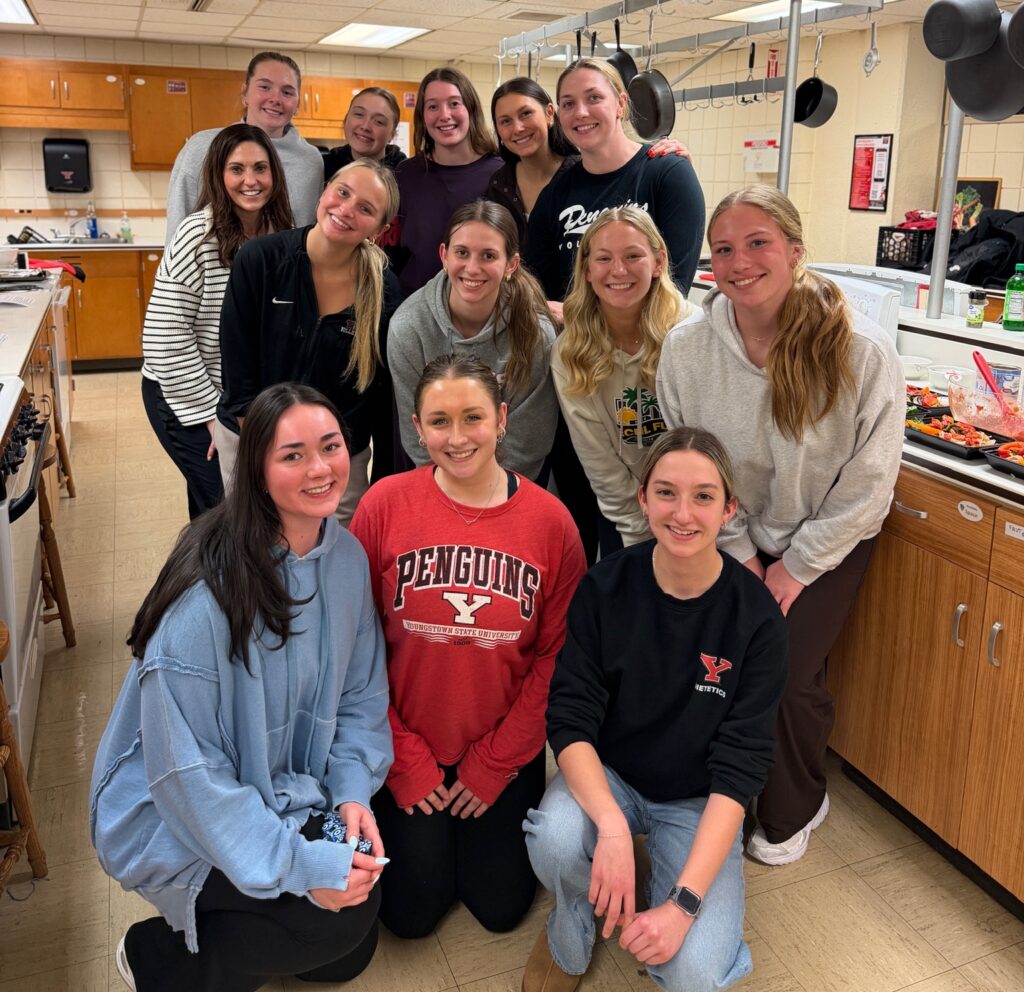 Dietetics students pose for a group photo after preparing a meal for the YSU volleyball team.