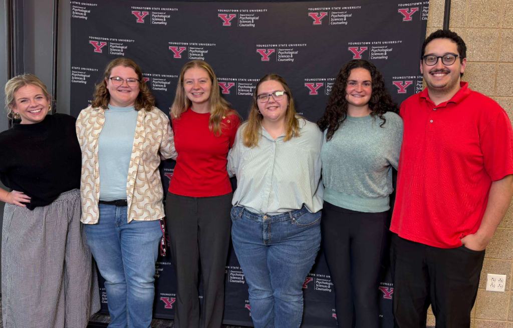 YSU College Counseling and Student Affairs student affairs students smiling at an event.