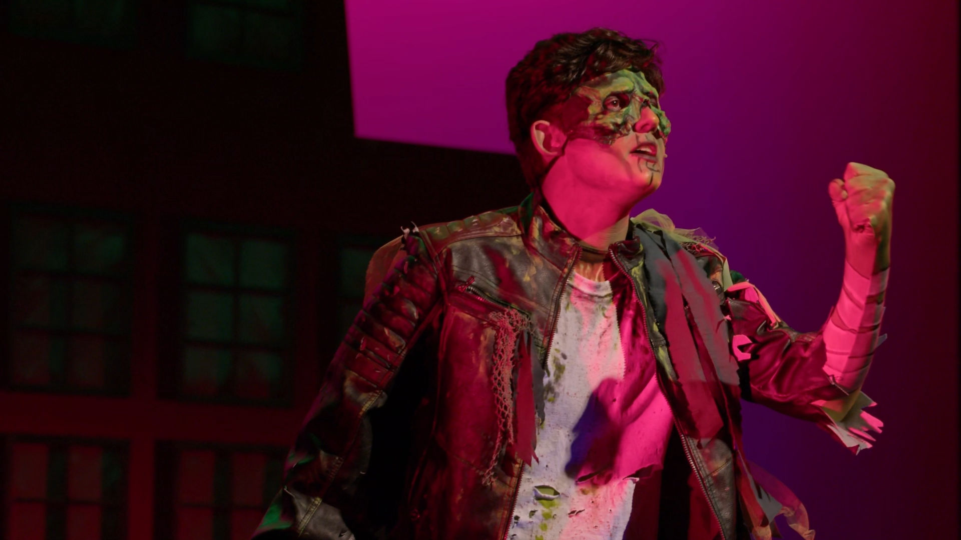 Student performing in zombie makeup for the musical, Zombie Prom.