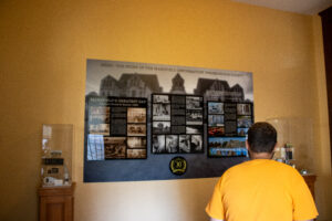 YSU History student reading a plaque in the Ohio State Reformatory